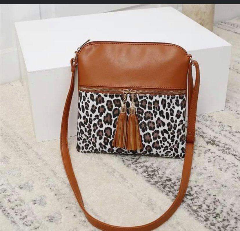 Cognac and cheetah sling purse